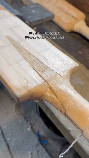 New cane handle being fitted into a bat